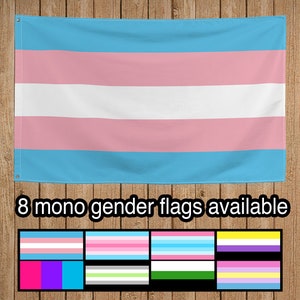 May include: A blue, pink, and white transgender pride flag hanging on a wood panel background. The text "8 mono gender flags available" is below the flag. Eight smaller flags are displayed below the text, each with a different color scheme.