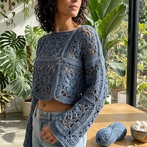 May include: A set of three ceramic vases in varying heights and shapes. The vases are glazed in a matte white finish, offering a minimalist aesthetic. The tallest vase measures approximately 10 inches high.