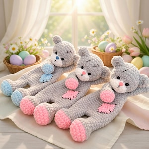 May include: A white ceramic mug with a black handle and the text "But First, Coffee" in a black, handwritten-style font. The mug is on a white surface.