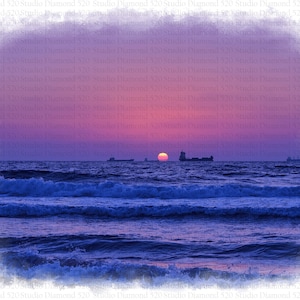 May include: A vibrant sunset over the ocean with a deep blue hue. The sun is setting in the distance, casting a warm glow on the water. The sky is a mix of pink, purple, and orange.