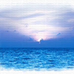 May include: A vibrant sunset over a calm blue ocean. The sky is a mix of pink, purple, and blue, with fluffy white clouds. The sun is setting behind the clouds, casting a warm glow on the water.