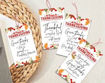 May include: Four printable Thanksgiving gift tags with fall foliage and berries. Each tag features a different Bible verse about giving thanks. The text on the tags reads: "Give thanks to the Lord for He is good. His love endures forever." "Let us be thankful and so worship God acceptably with rever and awe." "Give thanks to the Lord, make known His deeds." "Rejoice always, pray continually. Give thanks in all circumstances."