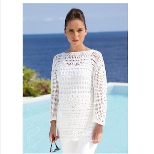 May include: White crochet top with a loose fit and long sleeves. The top features a delicate, openwork design and a scalloped hem.