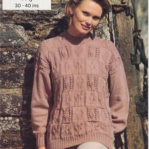 May include: A pink knitted sweater with a cable knit pattern. The sweater is 30-40 inches in length. Ladies Sweater 4 Ply.