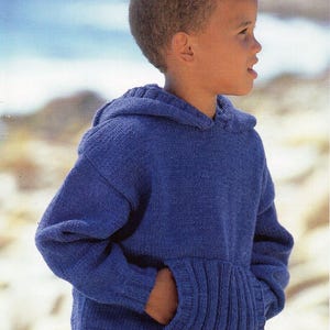May include: A blue knitted hoodie with a pocket on the front. The hoodie is made with a crepe double knitting technique. The pattern number is 4313 and the size is 56-81cm (22-32 inches).