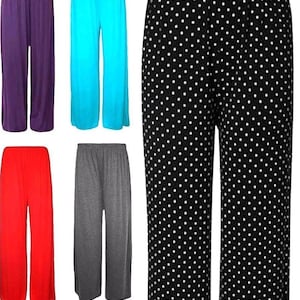 May include: A collection of 10 pairs of wide-leg trousers in various colours, including black, purple, turquoise, blue, red, grey, pink, brown, burgundy, and black with white polka dots.