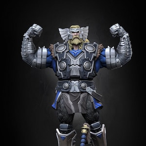 May include: A detailed figurine of Thor, the Norse god of thunder, in a powerful pose. He is wearing a silver and blue armor with a winged helmet and wielding a hammer.