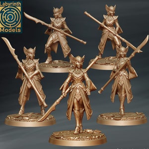 May include: Five miniature figurines of elven warriors, each holding a spear and standing on a circular base. The figures are painted in a metallic gold colour and have intricate details.