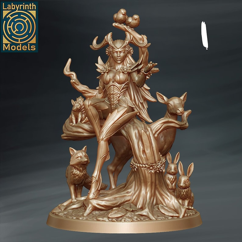 May include: A golden statue of a female figure with antlers, wings, and a flowing dress. She is surrounded by animals, including a deer, a fox, and two rabbits. The statue is set on a tree stump base.