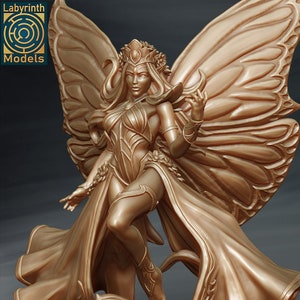 May include: A golden statue of a fairy with large butterfly wings. The fairy is wearing a crown and a flowing gown. The statue is detailed and intricate.