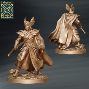 May include: A gold-colored miniature figurine of a female elf warrior with a sword and bow. She is wearing a flowing robe and a crown with feathers. The figurine is standing on a base with mushrooms.