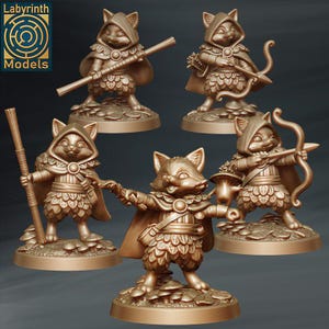 May include: Five miniature painted figurines of cats dressed as adventurers. Each cat is wearing a different outfit and holding a different weapon. The cat figurines are standing on round bases.