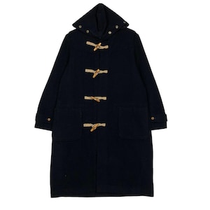 May include: A navy blue duffel coat with a hood and wooden toggle closures. The coat has two front pockets and button details on the sleeves. A classic outerwear garment.