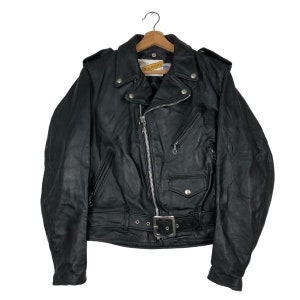 May include: Black leather motorcycle jacket with a zipper closure, a belt, and multiple pockets.