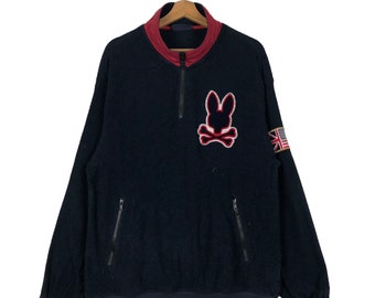 Chaqueta con cremallera Psycho Bunny de Robert Godley (2005) con logotipo grande