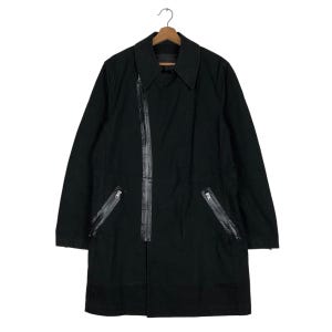 May include: A black long-sleeved jacket with a zipper down the front and two zippered pockets on the sides. The jacket has a collar and is made of a thick fabric.