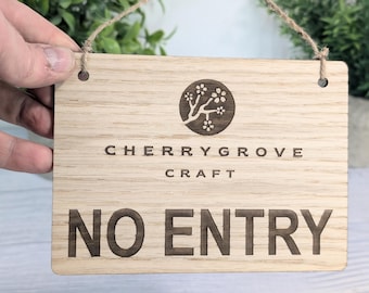 May include: A wooden sign with a cherry blossom logo and the text "Cherry Grove Craft" and "No Entry".