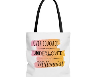 May include: White tote bag with black handles and a colourful design. The design features a pink, orange, and yellow watercolour-style background with the text "Over Educated", "Underloved", and "Millennial" in black.