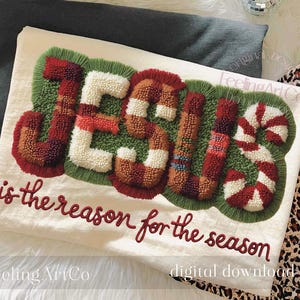 Puede incluir: Textil color crema con la palabra «JESUS» en un diseño texturizado y colorido, rodeado de verde. El texto «is the reason for the season» está debajo. El diseño tiene acentos rojos, blancos y marrones.