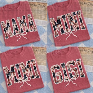 May include: Four red t-shirts with patriotic designs. Each shirt features a different name: "MAMA", "MINI", "MIMI", and "GIGI", with the letters filled with American flag patterns and a bow.
