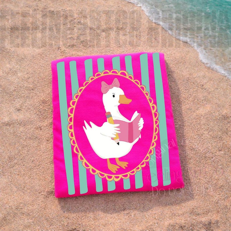 May include: A pink beach towel with teal vertical stripes. The towel features a cartoon goose wearing a pink bow and holding a pencil and book inside a pink oval frame with a gold scalloped border. The towel is lying on a sandy beach.