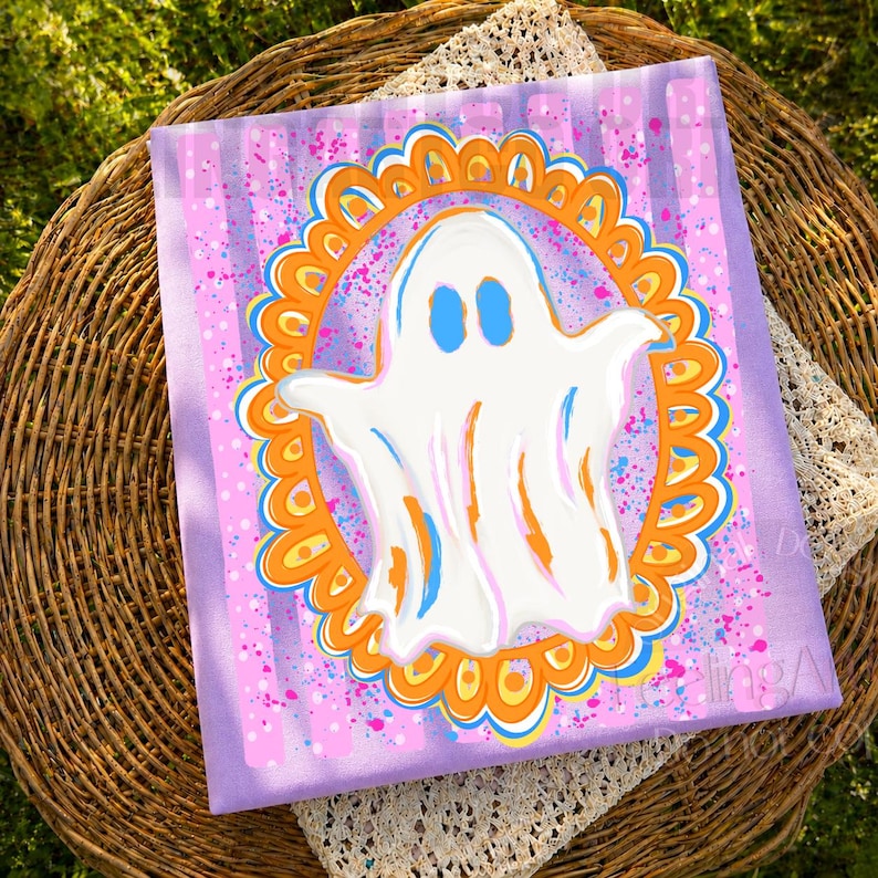 May include: A rectangular canvas painting featuring a central white ghost with blue eyes, enclosed within an orange and blue scalloped oval frame. The background consists of vertical light purple stripes with scattered pink and blue paint splatters.