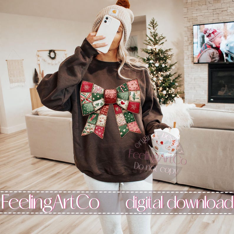 May include: A brown sweatshirt featuring a large, colorful bow design with a patchwork pattern of Christmas-themed squares. The bow has red, green, and white accents. The text "FeelingArtCo digital download" is at the bottom.