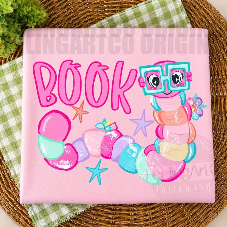 May include: A light pink fabric square featuring the word BOOK in large pink letters. A colorful cartoon worm with teal glasses, pink, blue, and yellow segments, and small floral accents is illustrated alongside orange, purple, and teal star shapes.
