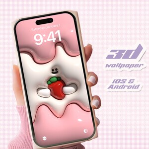 May include: A pink and white 3D phone wallpaper with a cartoon character holding a strawberry. The wallpaper is designed for both iOS and Android devices. The phone screen displays the time "9:41" and the date "Saturday, January 1".