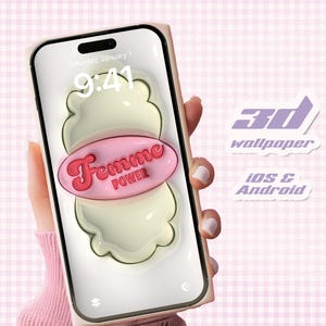 May include: A pink and white 3D phone wallpaper with the text "Femme Power" on a smartphone screen. The wallpaper is designed to look like a 3D object.