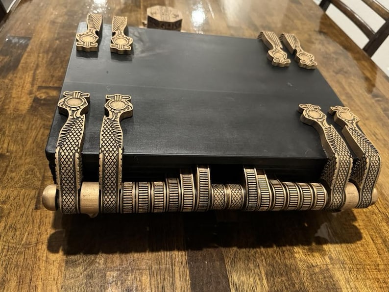 Detailed spine and rear construction of ancient Egyptian book prop