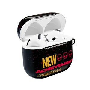 May include: A black wireless earphone charging case with an open lid, containing two white earbuds. The case features the yellow and red text NEW ACHIEVEMENT, three small skull icons, and the text CRAWLER #4122 printed on the front surface.