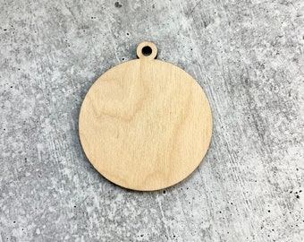 May include: A round, unfinished wooden ornament with a small hole at the top for hanging. The ornament is light brown and has a smooth surface. Ideal for DIY crafts and personalized decorations.