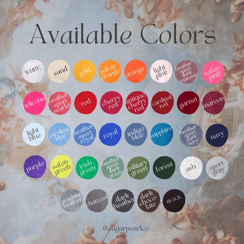 May include: A chart of available colours for clothing, with colour swatches in circles. The colours include white, sand, gold, safety orange, orange, light pink, heather sport dark maroon, safety pink, heliconia, heather sport scarlet, red, cherry red, antique cherry red, cardinal red, garnet, maroon, light blue, carolina blue, heather sport royal, royal, indigo blue, sapphire, heather sport dark navy, navy, purple, safety green, irish green, heather sport dark green, military green, forest, ash, sport grey, graphite heather, charcoal, dark heather, dark chocolate, black.