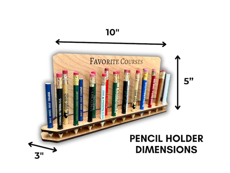 May include: A wooden pencil holder with the text "FAVORITE COURSES" engraved on the front. The holder is 10 inches wide, 5 inches tall, and 3 inches deep. It has 18 slots for pencils, each with a different golf course name printed on it.