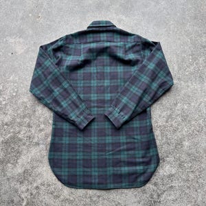 May include: A set of three ceramic mugs with a speckled, matte finish. The mugs are in shades of cream, light gray, and dark gray. Each mug has a simple, minimalist design, perfect for coffee or tea.