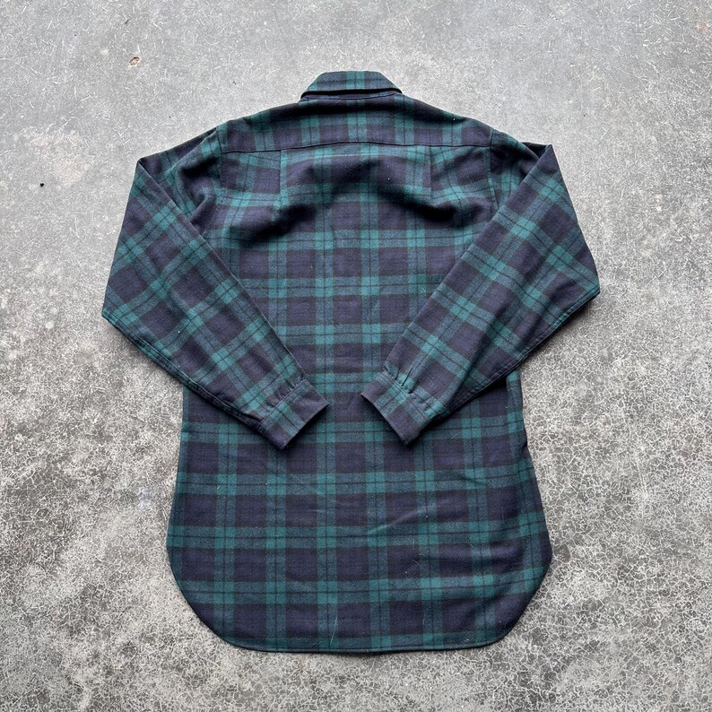 May include: A set of three ceramic mugs with a speckled, matte finish. The mugs are in shades of cream, light gray, and dark gray. Each mug has a simple, minimalist design, perfect for coffee or tea.