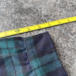 May include: A rustic wooden sign with the text "Welcome to our home" in white lettering. The sign features a distressed finish and a simple, inviting design, perfect for entryway decor.