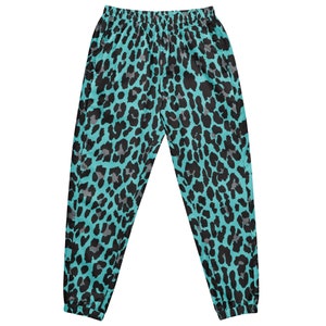 May include: Teal blue sweatpants with a black leopard print pattern.