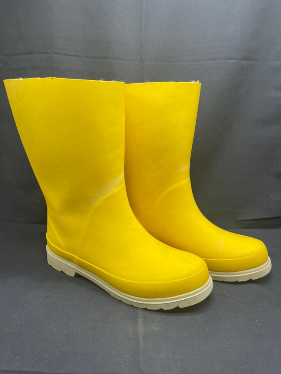 Vintage woman’s insulated yellow rubber rain boots