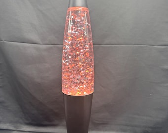 Lámpara de lava vintage rosa con forma de cohete y purpurina