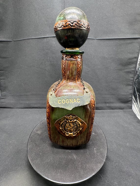 Vintage Italian Leather Wrapped Cognac Decanter With A Lion Crest 