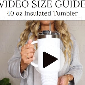 May include: White 40 ounce insulated tumbler with a black lid and handle. The tumbler has a stainless steel construction and double-wall insulation. The text "VIDEO SIZE GUIDE" and "40 oz Insulated Tumbler" is visible at the top of the image.
