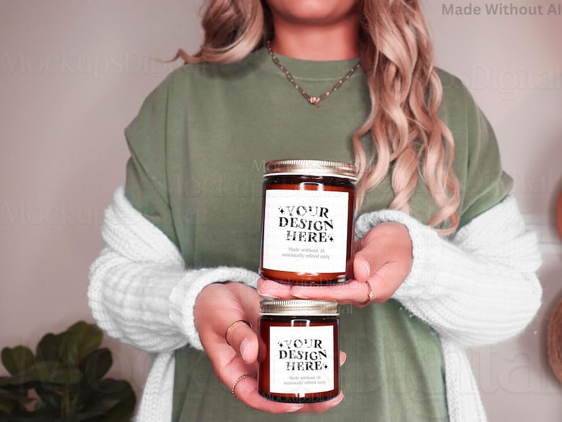 May include: Two brown glass candle jars with white labels. The labels have black text that reads "YOUR DESIGN HERE*" and "Made without AI, minimally edited only".