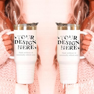 May include: Two white stainless steel tumblers with black text that reads "YOUR DESIGN HERE" and "Made without AI minimally edited only".