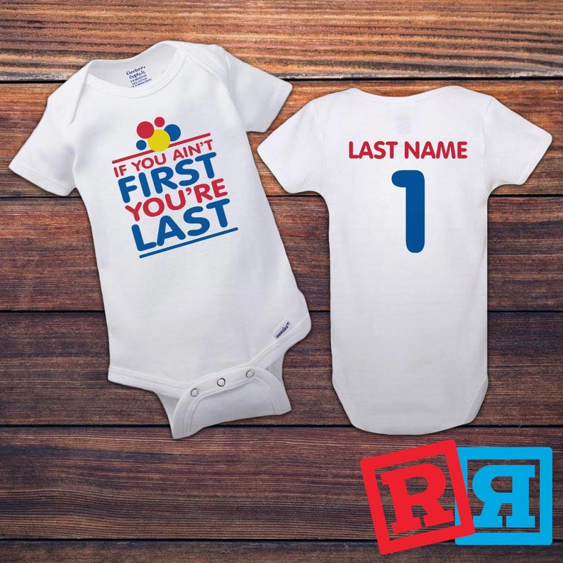 Personalized Talladega Nights baby onesie front and back image on table