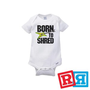 May include: White baby onesie with a black graphic of a guitar and the text "Born to Shred".