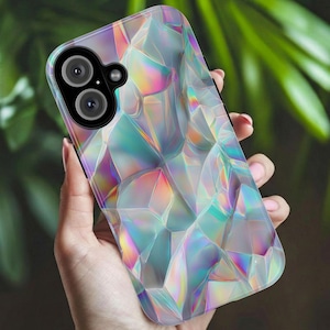 May include: A smartphone case with a geometric, iridescent design. The case features a pattern of interconnected, multi-faceted shapes that reflect a spectrum of colours, including pink, blue, and green. The case has a camera cutout.