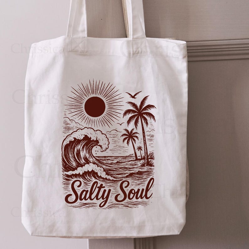 May include: A white canvas tote bag with a brown graphic of a sun, palm trees, and a wave. The text "Salty Soul" is printed below the graphic.