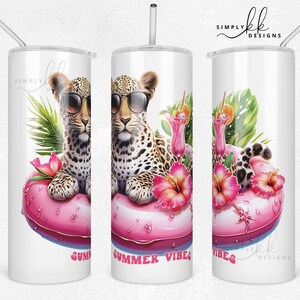 May include: White stainless steel tumbler featuring a leopard wearing sunglasses, floating on a pink inflatable ring. Tropical flowers and the words "Summer Vibes" are also on the tumbler. Includes a silver straw.